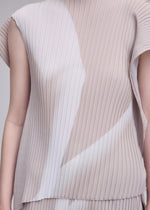 A person wears the ISSEY MIYAKE HANDS OF LOVER PLEATS top, a sleeveless, pleated garment in light beige and white with geometric patterns. Crafted from polyester crepe de chine and detailed with intricate inkjet printing, only the torso and part of an arm are visible against a neutral background.
