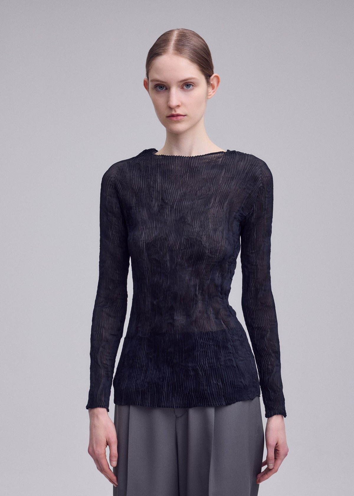 ISSEY MIYAKE CHIFFON TWIST BK/WT long-sleeved, black, sheer pleated top with a boat neckline crafted from recycled polyester. view 5 of 5