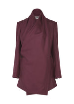 The MANNER by ISSEY MIYAKE is a burgundy lamb’s wool blazer with an asymmetrical drape, long sleeves, structured fit, layered design, hidden buttons, and modern eco-conscious style. - PURPLE （no.81）