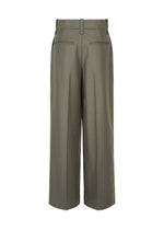 Back view of the SHELL trousers by ISSEY MIYAKE in olive green, featuring wide legs, belt loops, two rear welt pockets, and pressed center seams with a subtle wool texture reminiscent of classic straight pants.