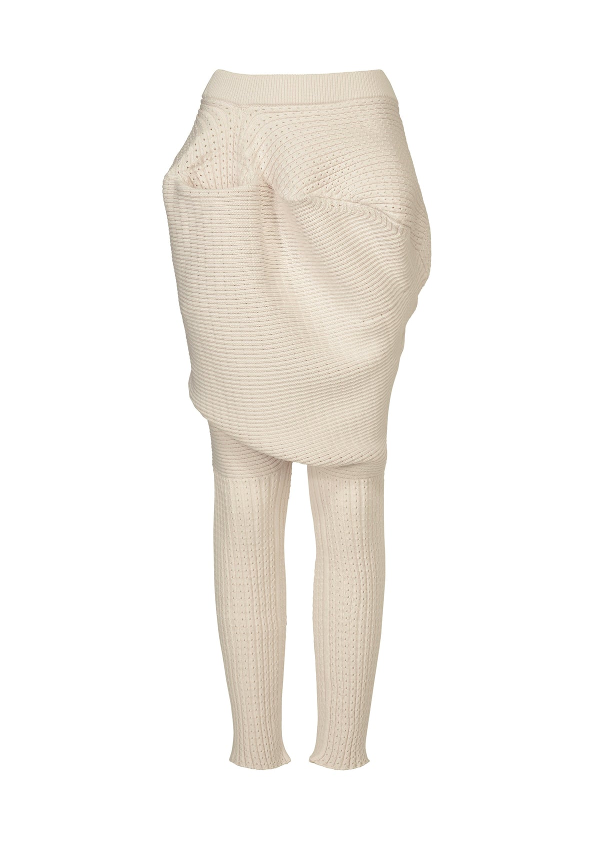 FOUND STONE by ISSEY MIYAKE is a cream-colored, ribbed knit piece combining a high-waisted skirt with attached leggings, featuring an asymmetrical drape and stone-inspired textures. view 1 of 8