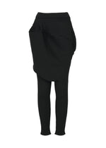 The FOUND STONE set by ISSEY MIYAKE features black, stone-inspired textured knitwear: a skirt with large draped pockets layered over matching fitted pants, shown on a white background. - BLACK （no.15）