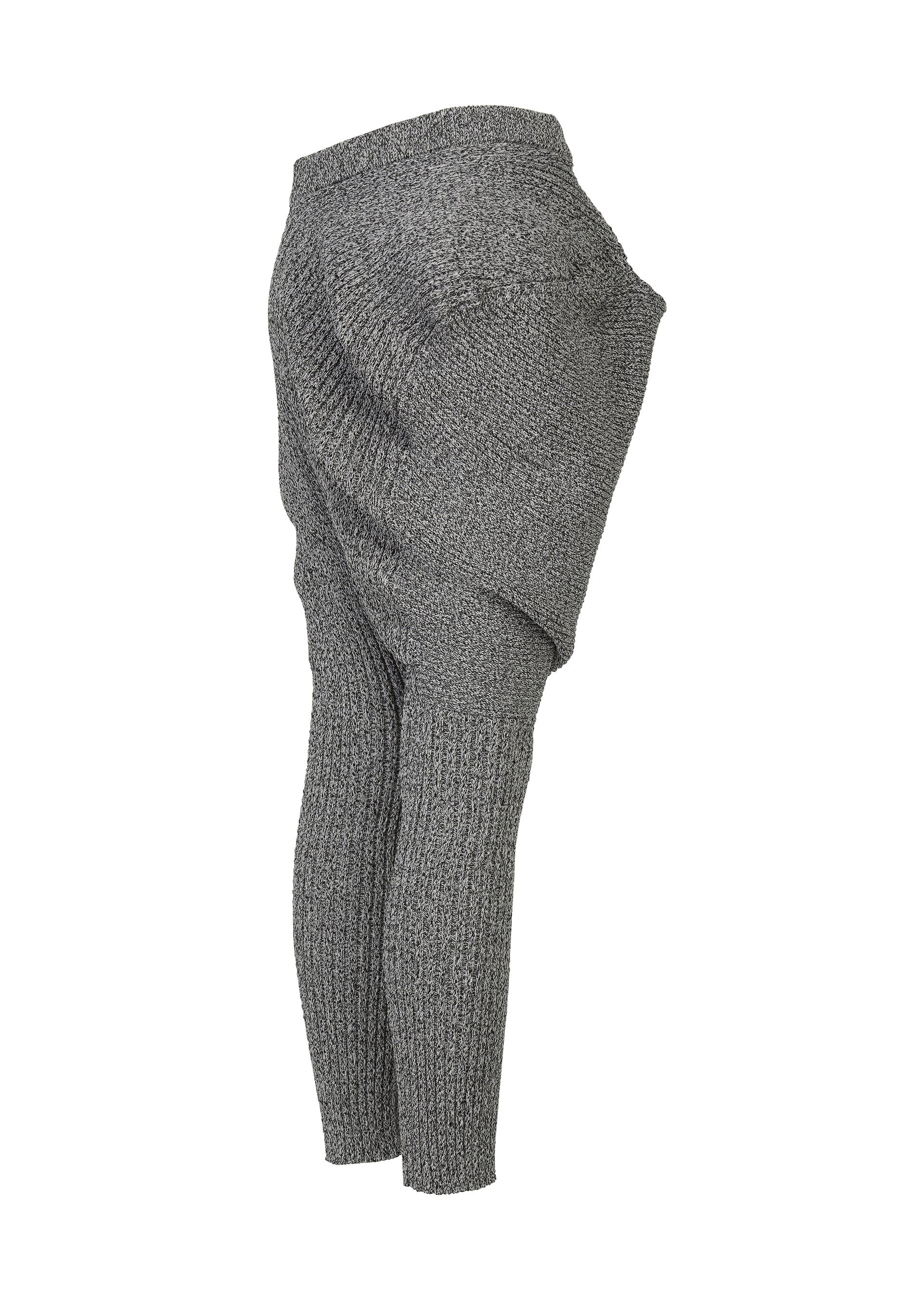 Zoomed view FOUND STONE sarouel pants by ISSEY MIYAKE, featuring a stone-inspired knit, exaggerated wide hips, and fitted lower legs. Shown in gray on a white background.