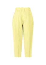 The CAMPAGNE pants by ISSEY MIYAKE are high-waisted and yellow with a tapered leg and side pockets, shown against a white background. Made from stretchy fabric, they feature stitched front seams and an elastic waistband for enhanced comfort.