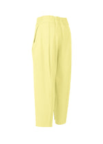 CAMPAGNE high-waisted cropped pants by ISSEY MIYAKE, in light yellow, feature a relaxed, slightly tapered fit with side pockets and an elastic waistband. Crafted from stretchy fabric, the pants are displayed on a white background.