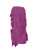 The KONE KONE skirt by ISSEY MIYAKE features a magenta knit with sculptural, wavy ribbed textures throughout. Its irregular hem and structured fabric with raised sections create a distinctive and uneven, architectural look.