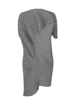 ISSEY MIYAKE’s FOUND STONE is a textured gray knit mini dress with an asymmetrical design, one sleeve, and an uneven hemline, displayed on a white background for a modern, stone-inspired look.