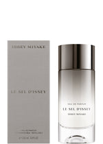 A bottle of LE SEL D'ISSEY EAU DE PARFUM 100mL by ISSEY MIYAKE PARFUMS sits beside its sleek light gray box, both with silver and gray text, reflecting the fragrance’s fresh marine seaweed and salty notes.