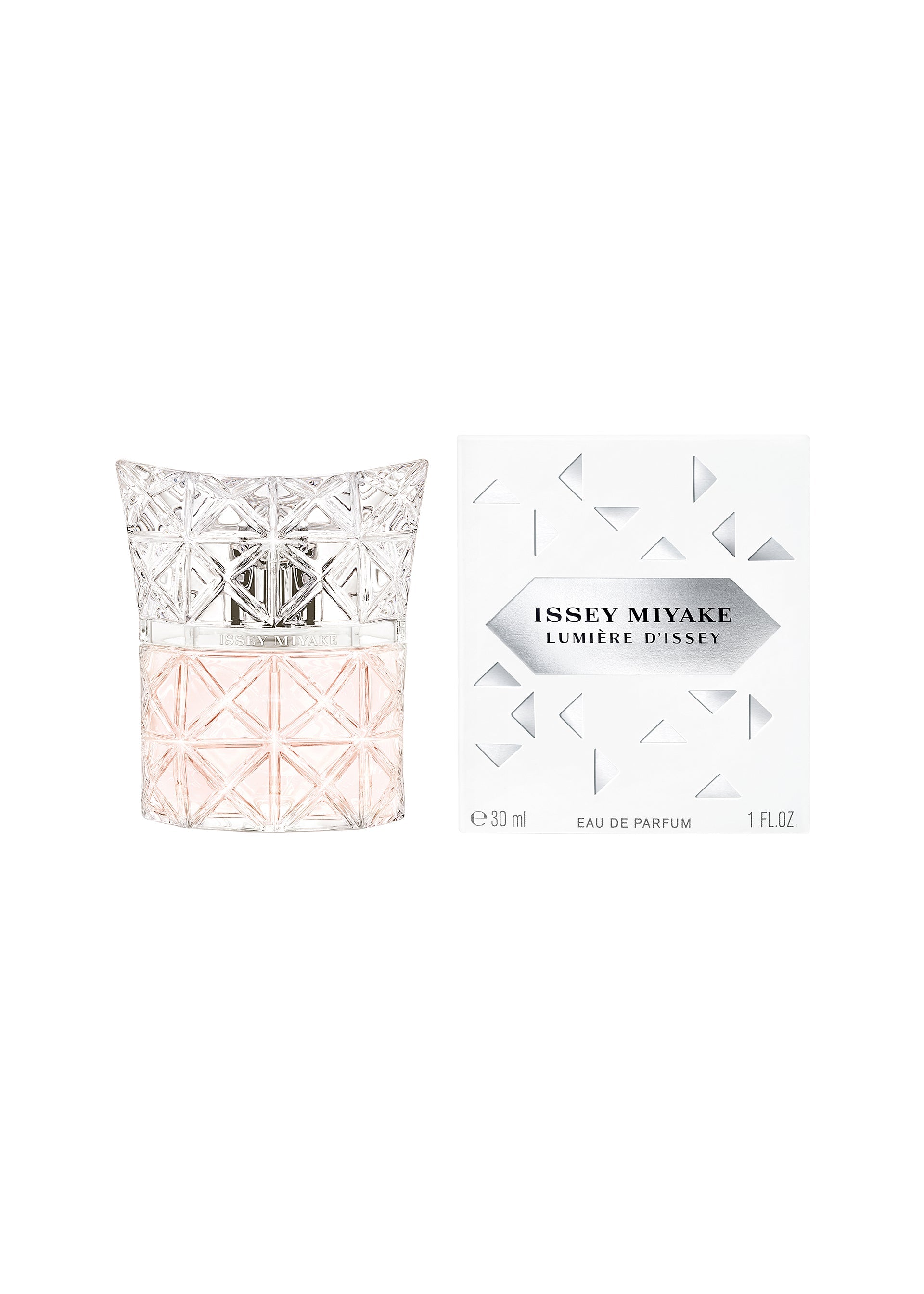Zoomed view A bottle of LUMIERE D’ISSEY EAU DE PARFUM by ISSEY MIYAKE PARFUMS, featuring pale pink liquid in a geometric, textured glass design, sits beside its white box decorated with metallic triangular patterns.