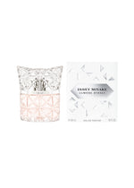 A 50mL bottle of LUMIÈRE D’ISSEY EAU DE PARFUM by ISSEY MIYAKE PARFUMS features a clear and pink glass design with a textured surface, shown beside its white box with a geometric pattern.