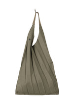 The GURU GURU by IM MEN is an olive green foldable tote with handmade pleats, tan handles, and a button closure—folds into a palm-sized package for easy carrying. - DARK BEIGE (no.43)