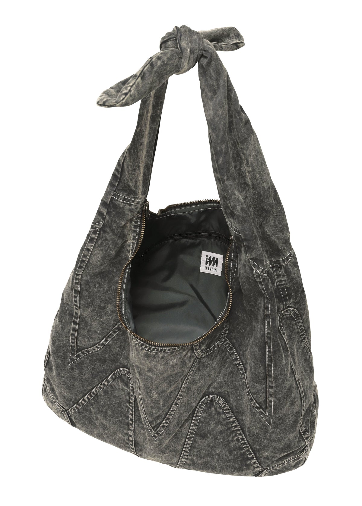 The ELEMENTS BAG by IM MEN is a slouchy, black acid-wash denim shoulder bag with a knotted handle, zigzag stitching, an open zipper, and a visible inner label—offering ceramic-inspired, artisanal flair. view 3 of 5