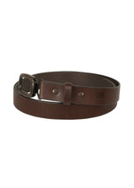 The OVAL belt by IM MEN is a rolled dark brown natural leather belt with an adjustable buckle and embossed branding near the tip, displayed against a white background. - BROWN （no.44）