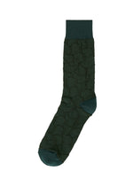The IM MEN VASE SOCKS feature a single dark green sock with a ceramic-inspired texture and solid-colored heel, toe, and cuff, shown against a white background. - DARK GREEN （no.63）
