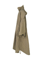 Side view of ENGRAVE by IM MEN: a loose, light brown jacquard coat featuring wide sleeves, high collar, textured wavy wave pattern, large front pockets, and an asymmetrical, sculptural design.