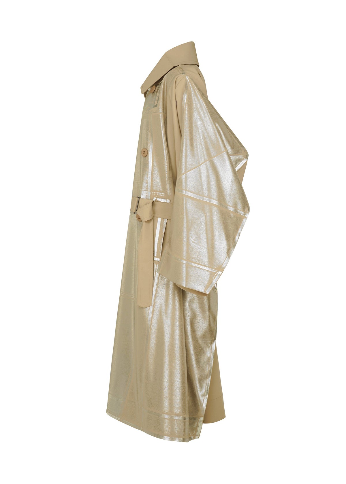 The GINTO FLAT by IM MEN is a beige, Shoji Kamoda–inspired oversized trench coat with a shiny metallic finish, wide sleeves, waist belt, and large collar in plant-based polyester, shown from the side on a white background. view 3 of 9