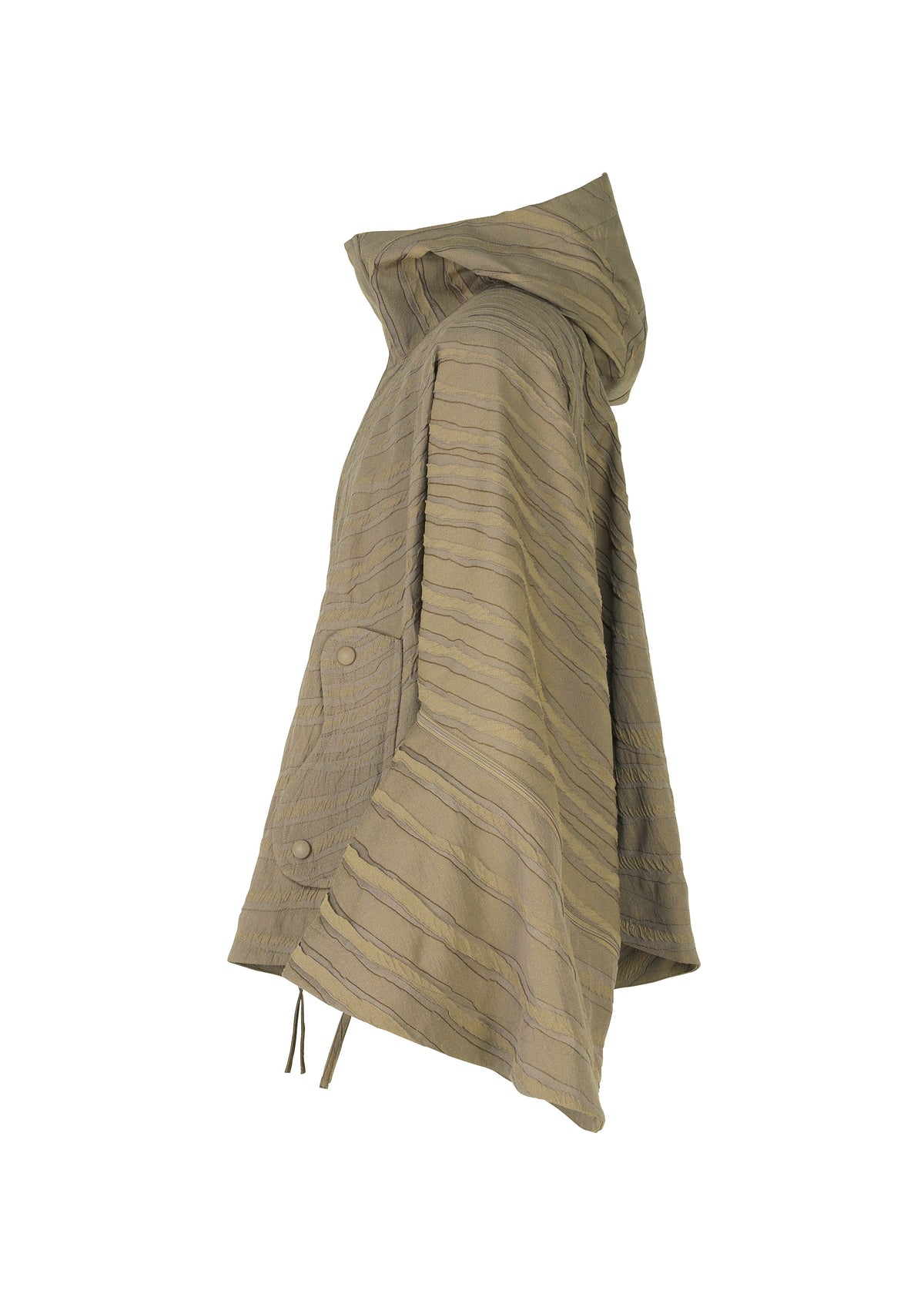 Side view of the ENGRAVE poncho-style jacket by IM MEN in light brown, with a hood, curved hem, and large buttoned pocket. Jacquard loom fabric features horizontal stitching and a 3D wave pattern for added texture. view 4 of 9