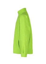 The IM MEN SHRINK JACQUARD features a neon green wood-grain woven design, viewed from the side, with long sleeves, high collar, and a loose, structured fit. Its crinkled fabric highlights the jacket's unique texture.