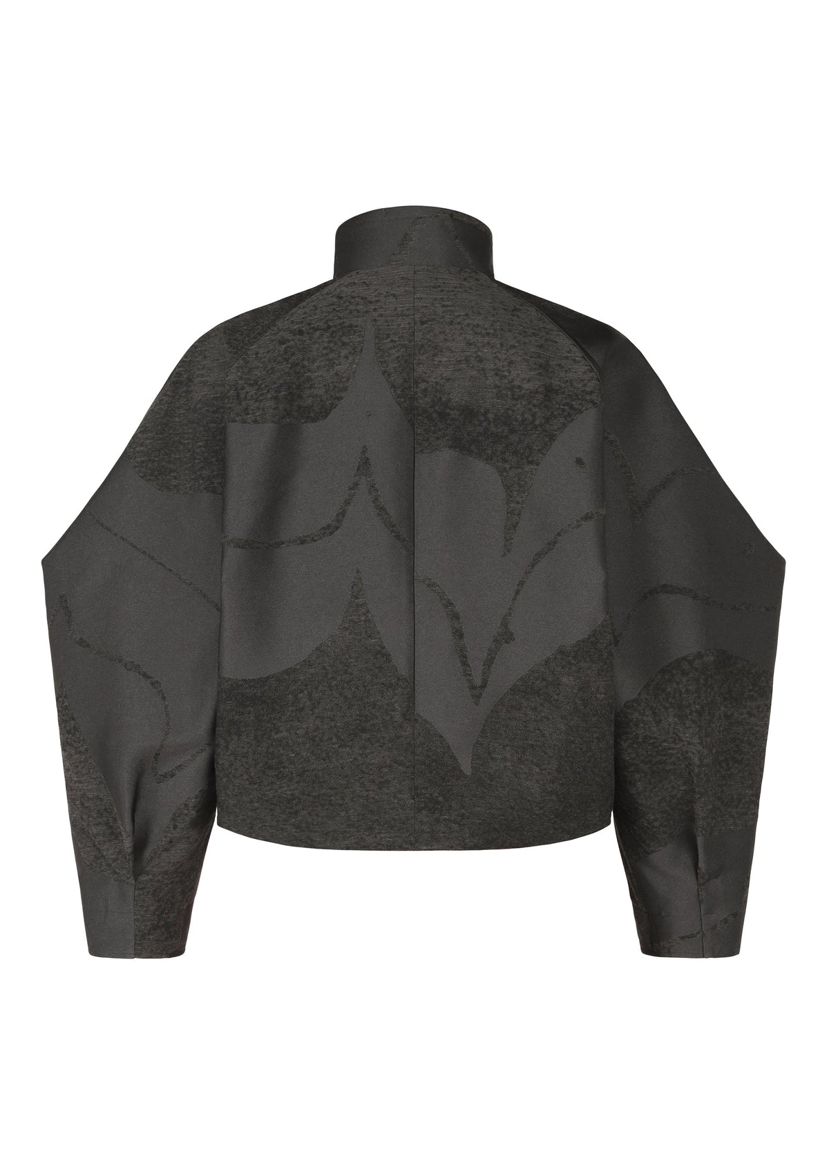 The image shows the back view of the INLAY jacket by IM MEN: a dark gray, long-sleeve, high-neck piece with a ceramic-inspired abstract pattern in lighter gray. The boxy cut highlights its jacquard-woven textured fabric. view 3 of 8