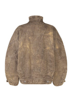 The ELEMENTS jacket by IM MEN is a brown distressed denim piece with a large stitched M on the back, high collar, thick cotton material, buttoned lower hem, and oversized sleeves.