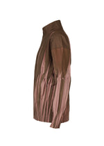 The EDGE by IM MEN is a brown long-sleeve shirt with a high collar and vertical, angular light pink pleats, inspired by Shoji Kamoda ceramics—displayed side-on against a plain white background.
