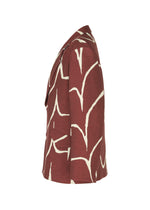 Side view of the IM MEN "EARTH" tailored jacket in maroon, featuring a white abstract branch-like pattern, displayed against a white background.