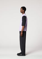 A person stands in profile against a plain light background, wearing the IM MEN RESILIENCE lightweight purple sleeveless vest over a black shirt, with black pants and shoes—ideal for everyday wear.