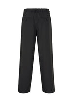 IM MEN's AIR PLEATS BLACK pants offer a loose fit for ease of movement, with two buttoned back pockets and belt loops around the waistband, viewed from the back.