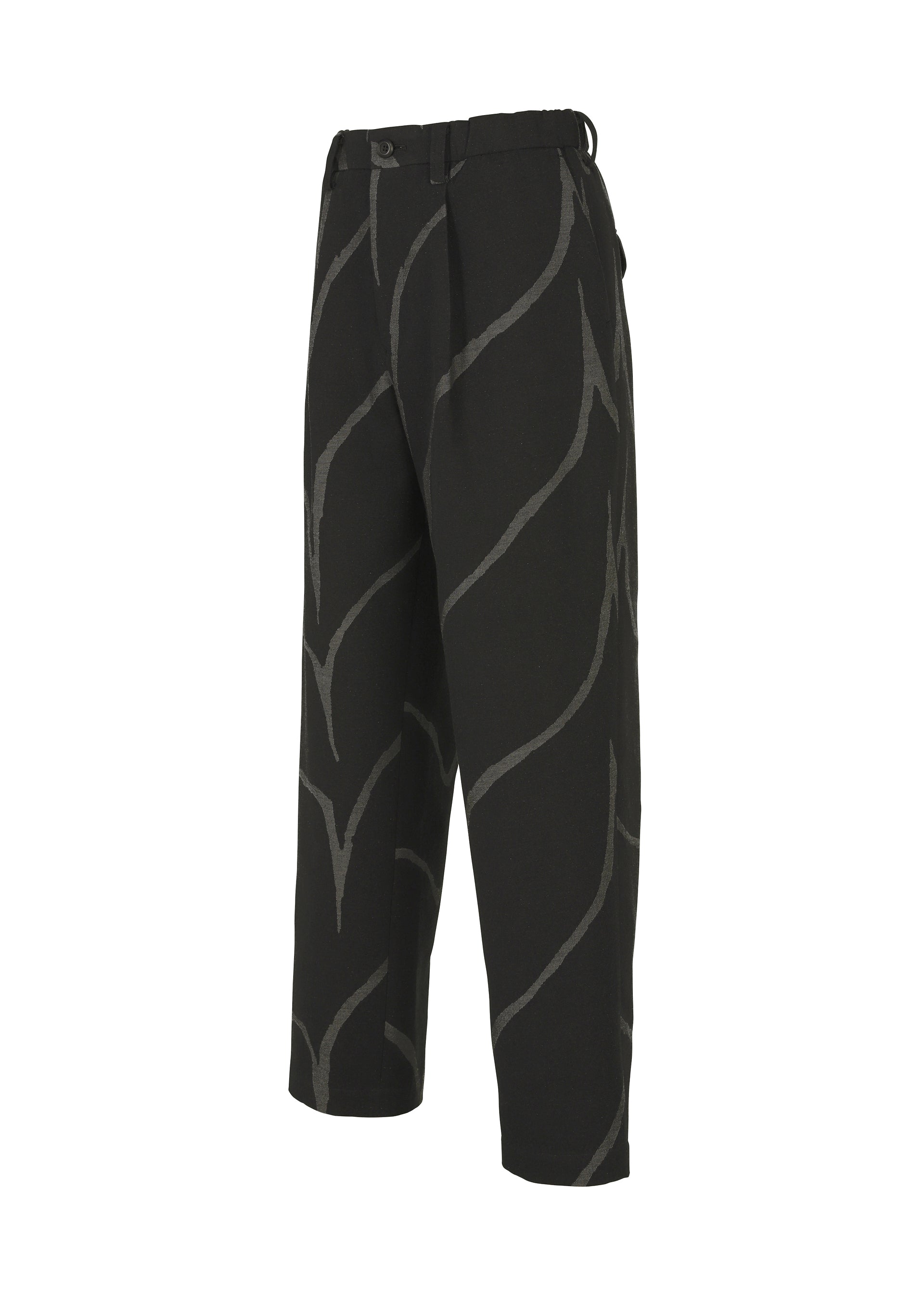 Zoomed view The EARTH pants by IM MEN are black, cropped, and loose-fitting with a bold jagged light gray wave pattern, belt loops, and a pleated front, shown on a plain white background.