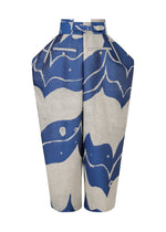 The INLAY pants by IM MEN are high-waisted, wide-leg jacquard loom trousers in a blue and white abstract wave pattern, featuring a matching belt and pleated waistband.