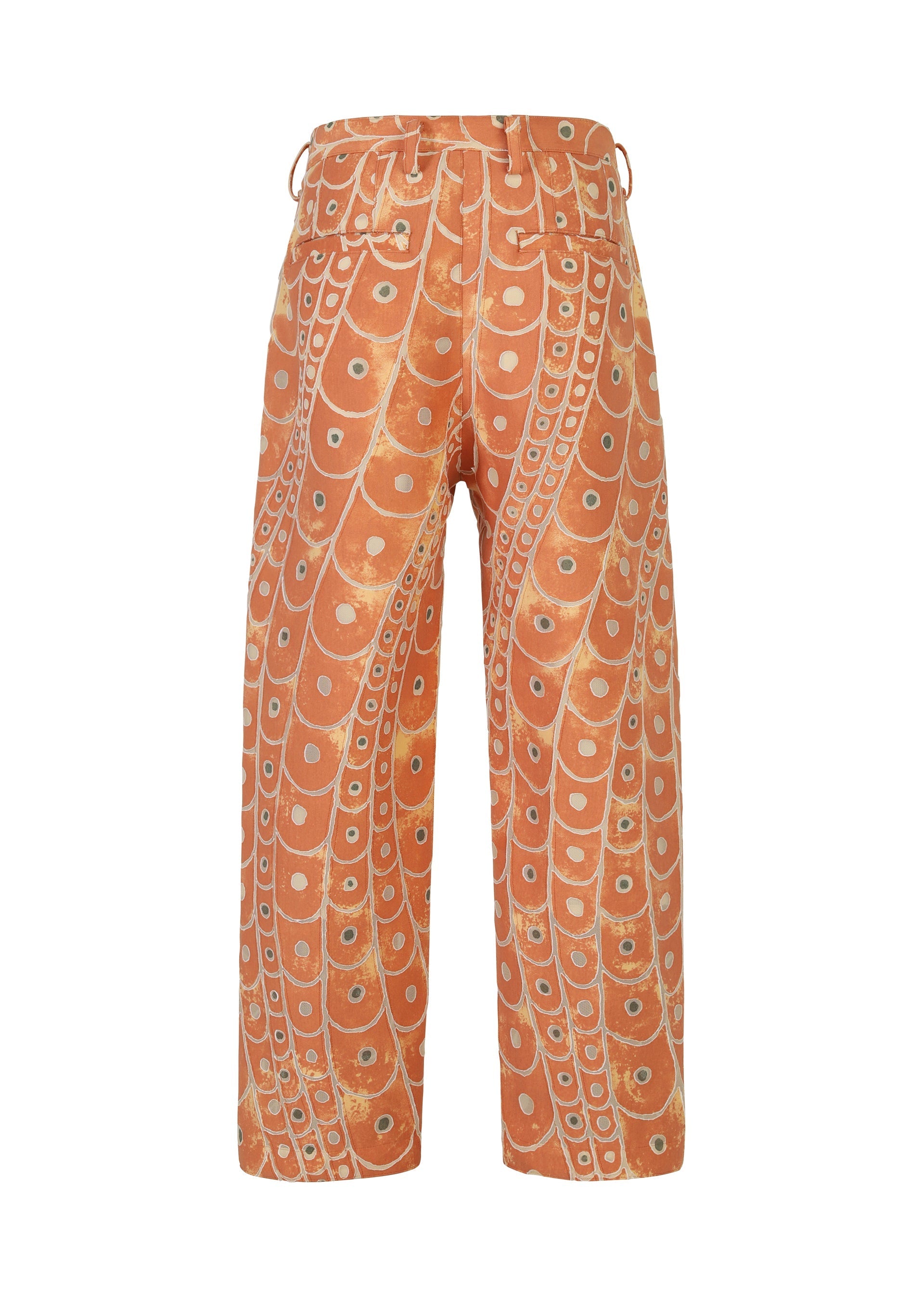 Zoomed view The IM MEN UROKOMON pants feature a high-waist, wide-leg silhouette in orange with abstract cream circle designs, plus visible belt loops and back pockets.