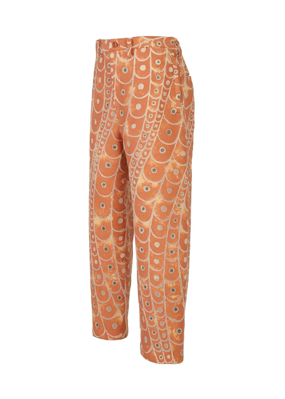 IM MEN's UROKOMON are loose-fitting orange pants with a high waist, showcasing bold white and light blue circular and curved patterns inspired by Shoji Kamoda’s scale-like designs. view 4 of 7