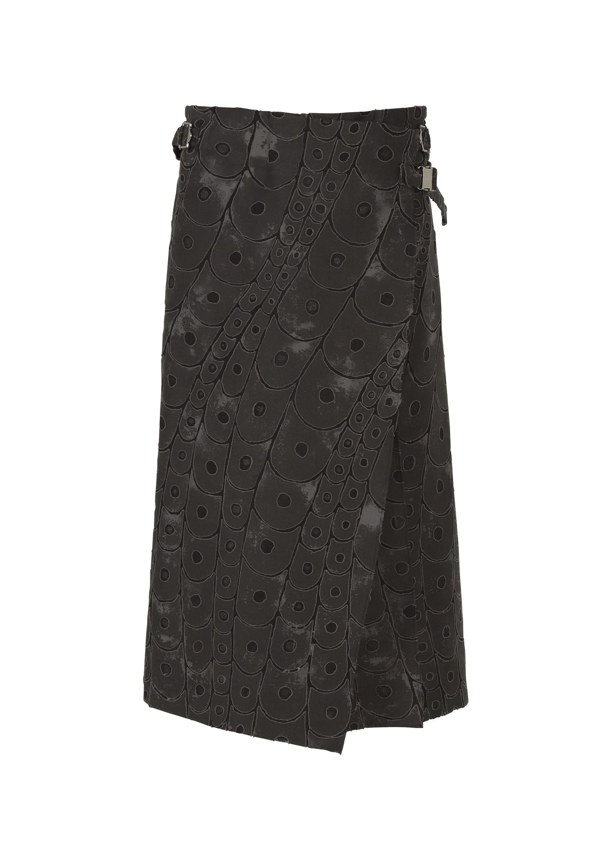 The UROKOMON wrap skirt by IM MEN features a black, knee-length design with a subtle circular ceramic-inspired pattern, two adjustable side buckles, and an asymmetrical hem for a modern Shoji Kamoda-inspired look. view 1 of 6