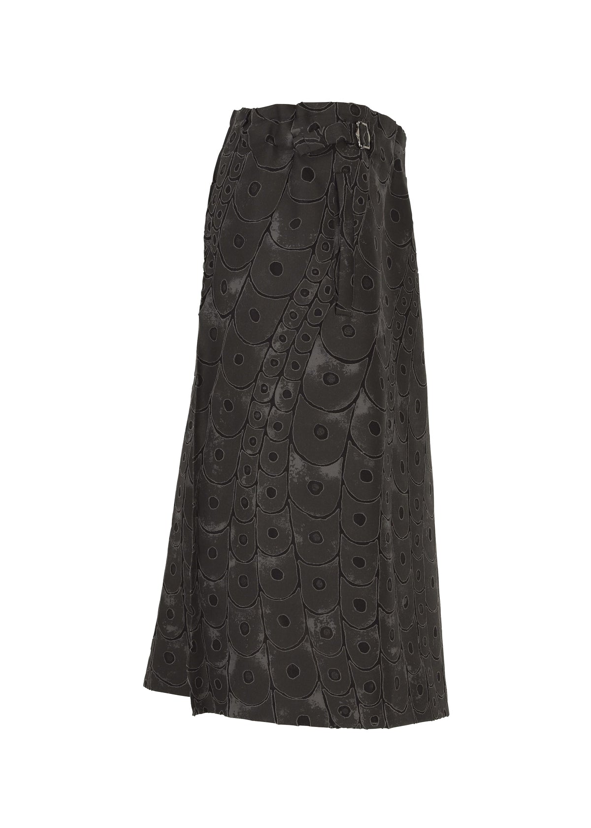 IM MEN’s UROKOMON is a knee-length black skirt with a circular pattern, high waist, side belt detail, and subtle flare—drawing on Shoji Kamoda’s ceramic-inspired textures for a modern, artful style. view 2 of 6