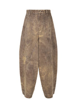 The ELEMENTS wide pants by IM MEN are brown, distressed, and made from thick cotton with curved seams and a button waistband, shown on a white background.
