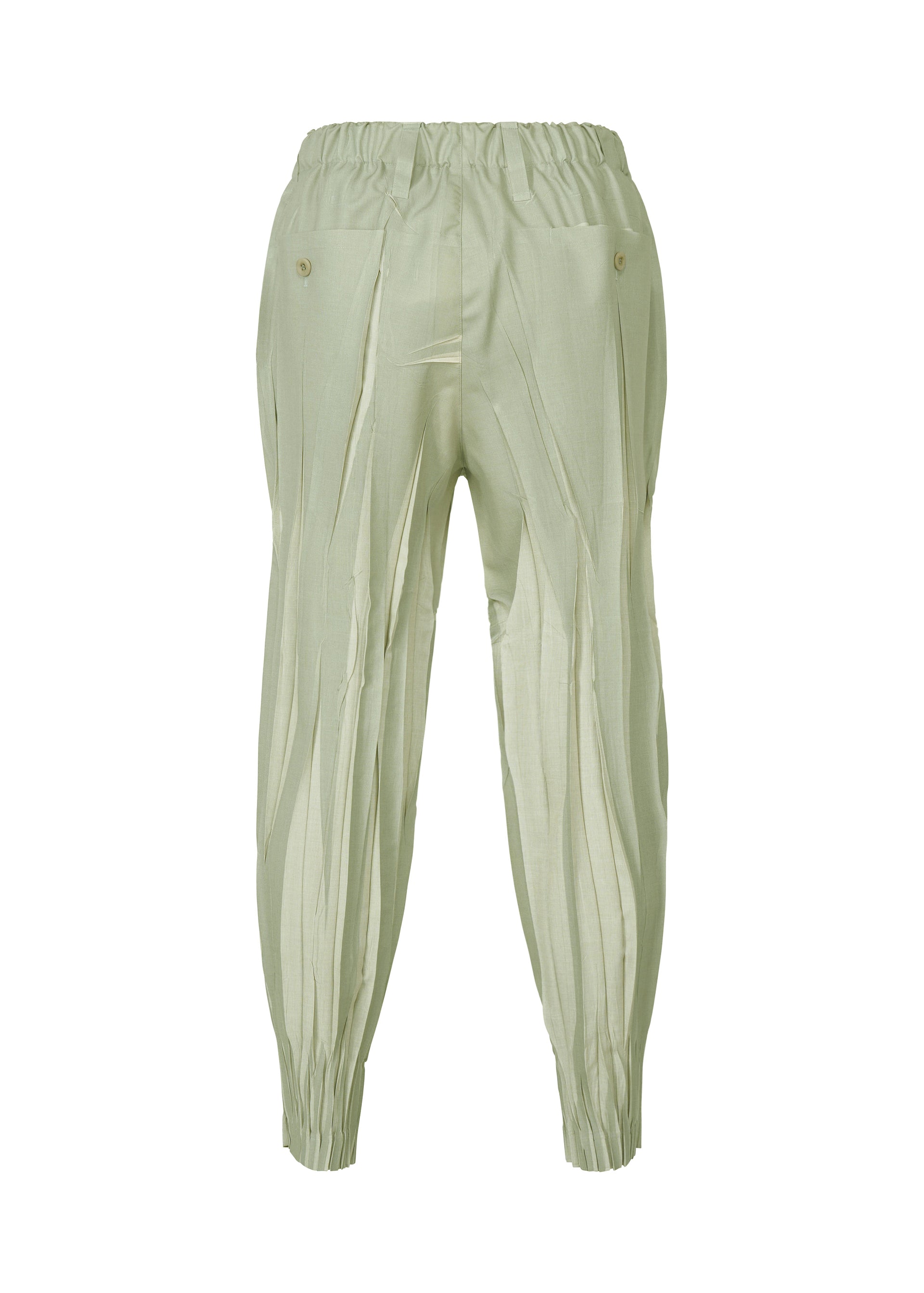 Zoomed view EDGE pleated pants by IM MEN in light green polyester, featuring an elastic waistband and cuffs, Shoji Kamoda-inspired vertical textured lines, and two buttoned back pockets. Shown on a white background.