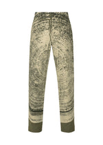 The IM MEN KAIYU pants are high-waisted, straight-leg trousers with pigment-printed abstract green and beige patterns resembling tree rings, finished with solid green ankle cuffs. - KHAKI （no.65）
