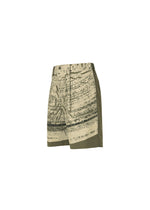 The IM MEN KAIYU shorts are khaki green ceramic artist shorts featuring an abstract black and beige print made with pigment printing, shown against a white background.