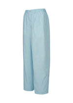 IM MEN's AIR WASH pants in light blue feature a high waist, wide-leg fit, lightweight plant-derived polyester, elastic back waistband, button closure, and side pockets. Shown on a white background.