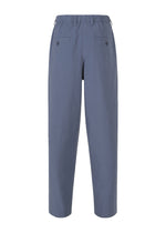 Back view of IM MEN NAVY BOTTOMS, loose-fitting organic cotton pants in navy with an elastic waistband, two buttoned back pockets, and a special wash for extra softness. Displayed on a plain white background.