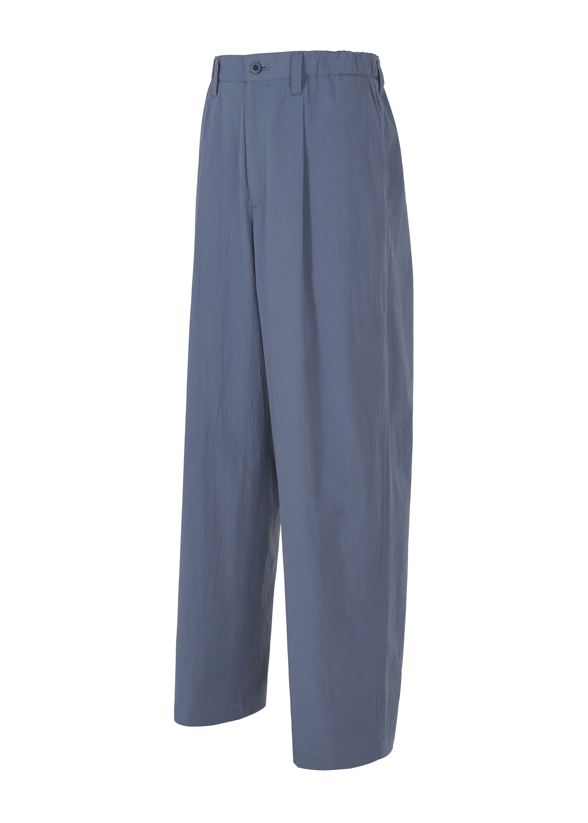 Zoomed view IM MEN’s NAVY BOTTOMS are wide-leg, high-waisted organic cotton pants in blue with front pleats, side pockets, button closure, and a subtle wash treatment, shown on a white background.
