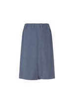IM MEN’s NAVY BOTTOMS are high-waisted, loose-fitting slate blue shorts made from breathable organic cotton with an elastic waistband, shown on a white background.