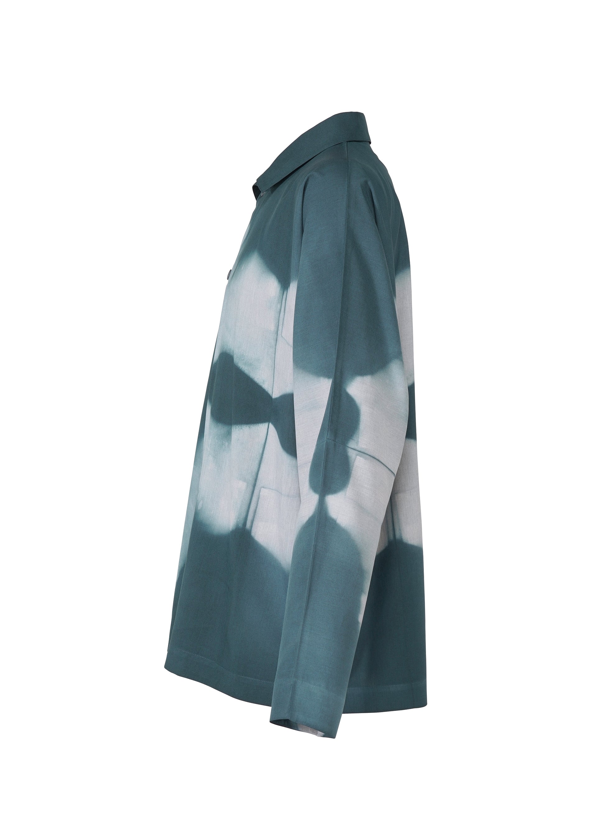 Zoomed view Side view of the IM MEN ITAJIME SHIRT, a long-sleeve button-up with a teal and white abstract geometric pattern inspired by Kyoto dyeing techniques, displayed against a white background.