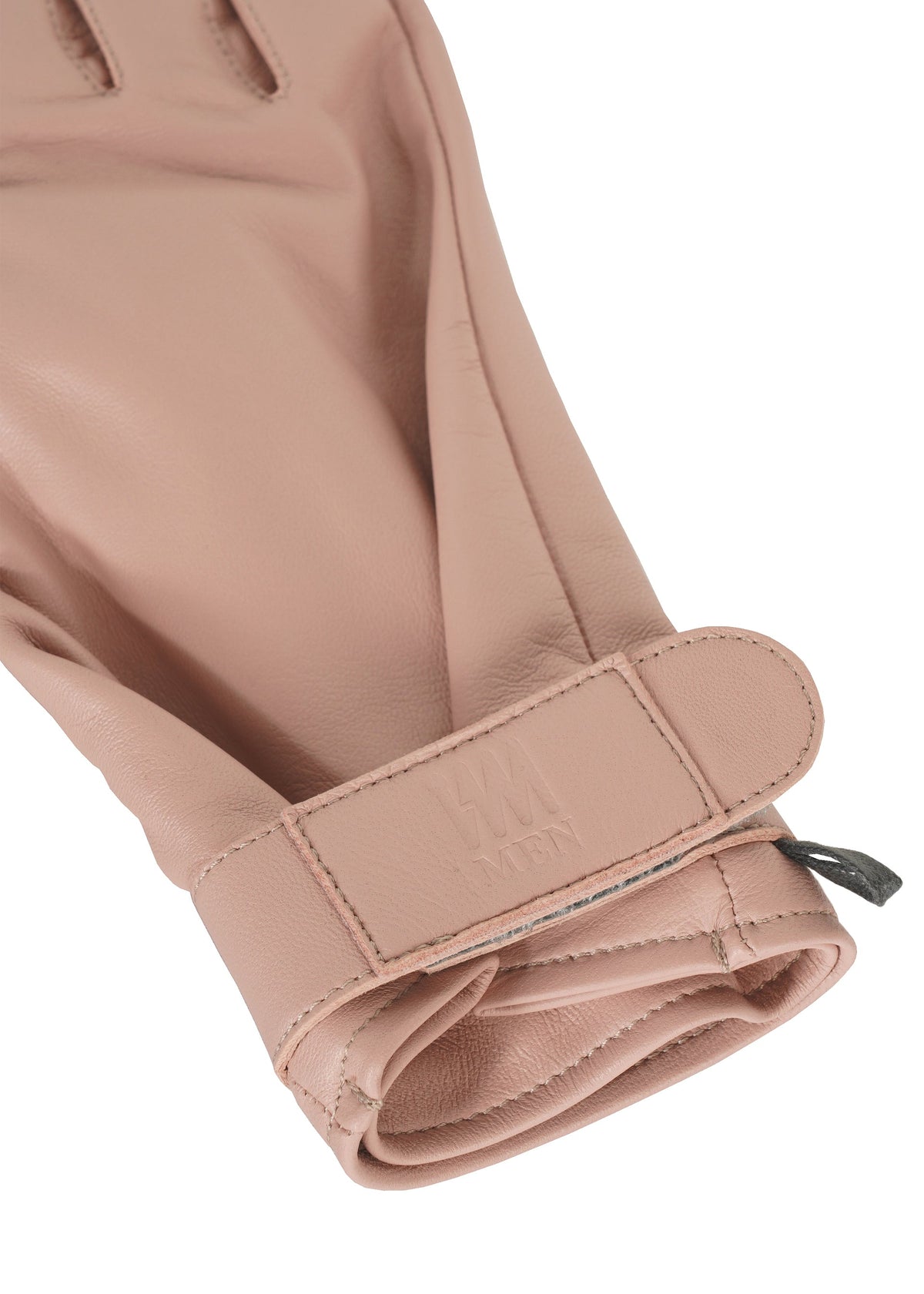 Zoomed view A close-up of the PIGEON GLOVES by IM MEN, made of light pink natural leather with a Velcro wrist strap, embossed branding, wide opening, and neat stitching.