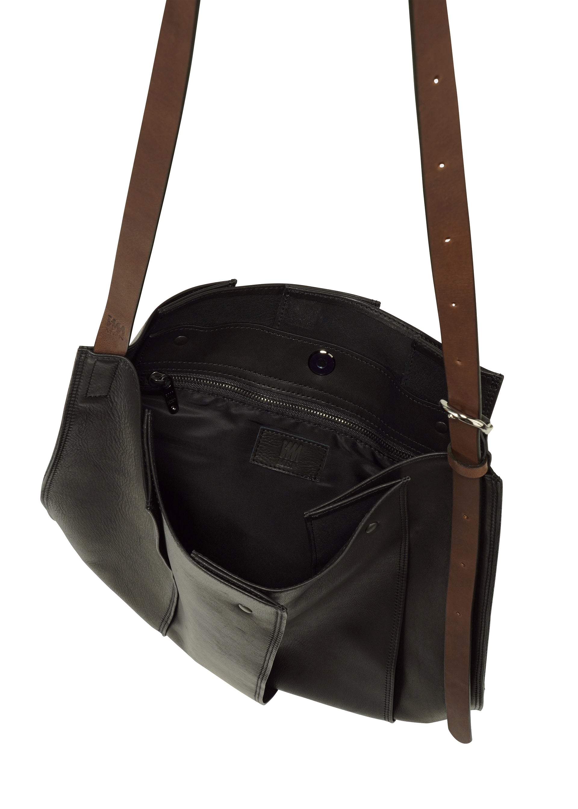 Zoomed view Introducing the LEATHER PLEATS by IM MEN—a black natural leather crossbody bag featuring brown adjustable straps. Shown open, it reveals an inner zippered pocket and multiple compartments, making it the perfect stylish 13-inch laptop bag for your daily essentials.