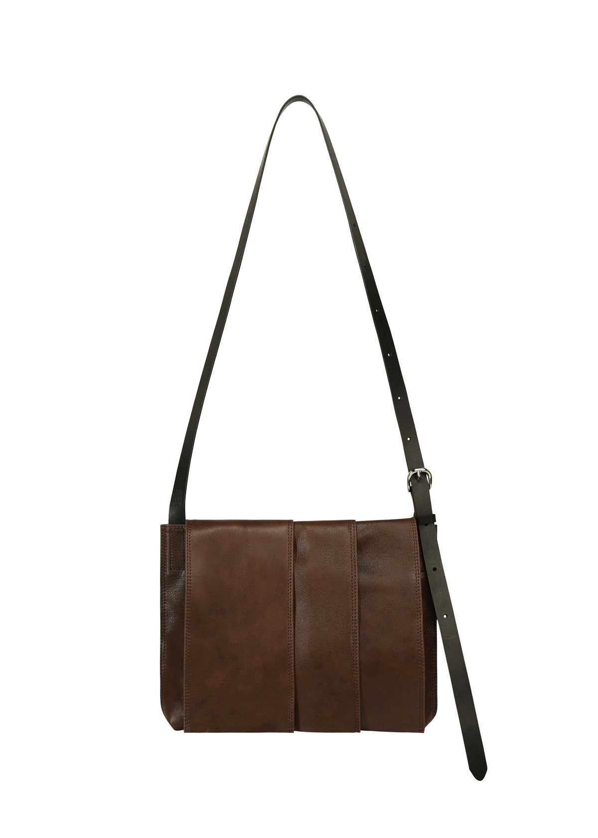 Introducing the LEATHER PLEATS by IM MEN—a brown natural-leather shoulder bag featuring a long, adjustable black strap and three vertical stitched panels on the front, inspired by the IM MEN Autumn Winter 2026/27 Collection and showcased against a white background. view 2 of 8