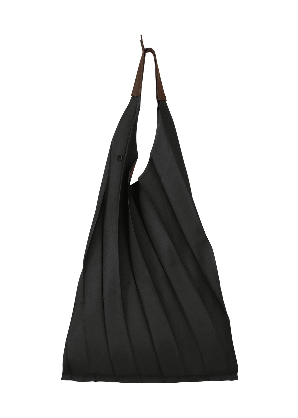 The GURU GURU tote bag by IM MEN is a pleated black fabric, foldable accessory with brown handles. Handmade pleats and diagonal folds give it a textured, sculptural look. Photographed against a white background. view 1 of 11