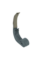 The IM MEN GURU GURU is a rolled-up gray tourniquet with a tan fastening strap and black button, partially unrolled to reveal its handmade pleats in an S-curve, shown against a white background.