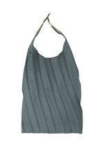 The IM MEN GURU GURU is a gray foldable tote bag with handmade pleats, a single handle, and button closure near the top, shown against a white background.