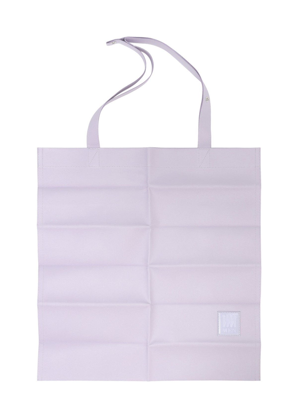 The PATA PA by IM MEN is a flat, light purple foldable tote bag in polyester suede, featuring two handles, horizontal creases, and a small white square patch at the bottom right. view 4 of 12